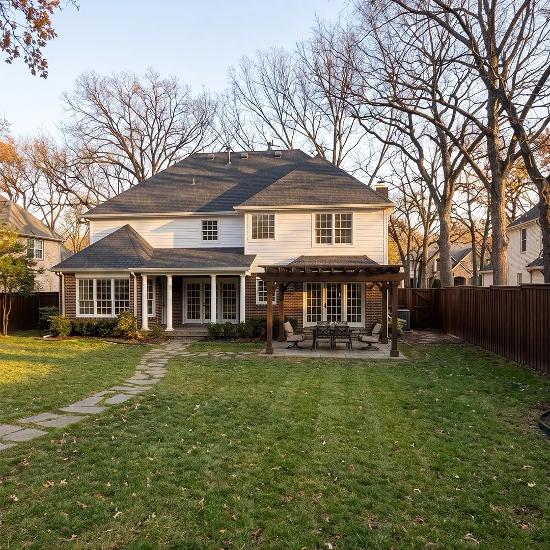 White suburban house with a clean green yard